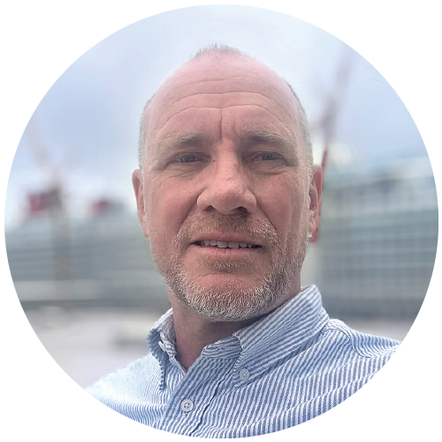 Portrait of Markus Ahlfeld, with a cruise ship blurred in the background